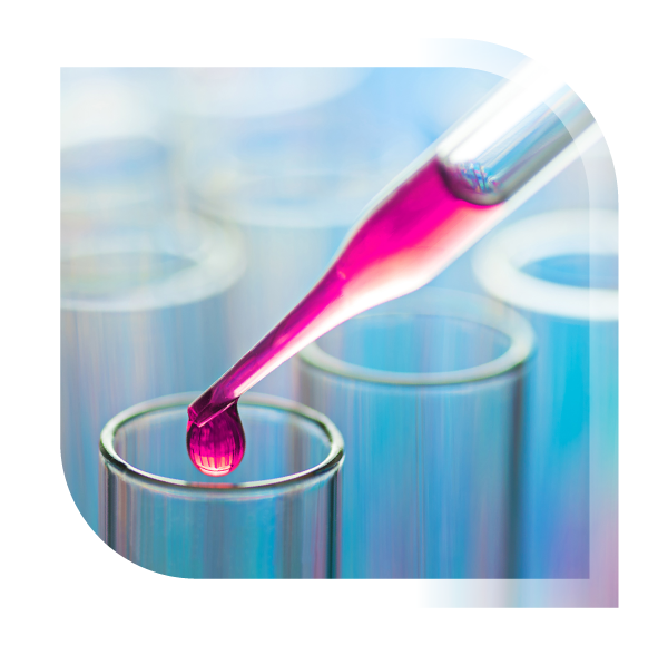 Pipette discharging pink fluid into test tube